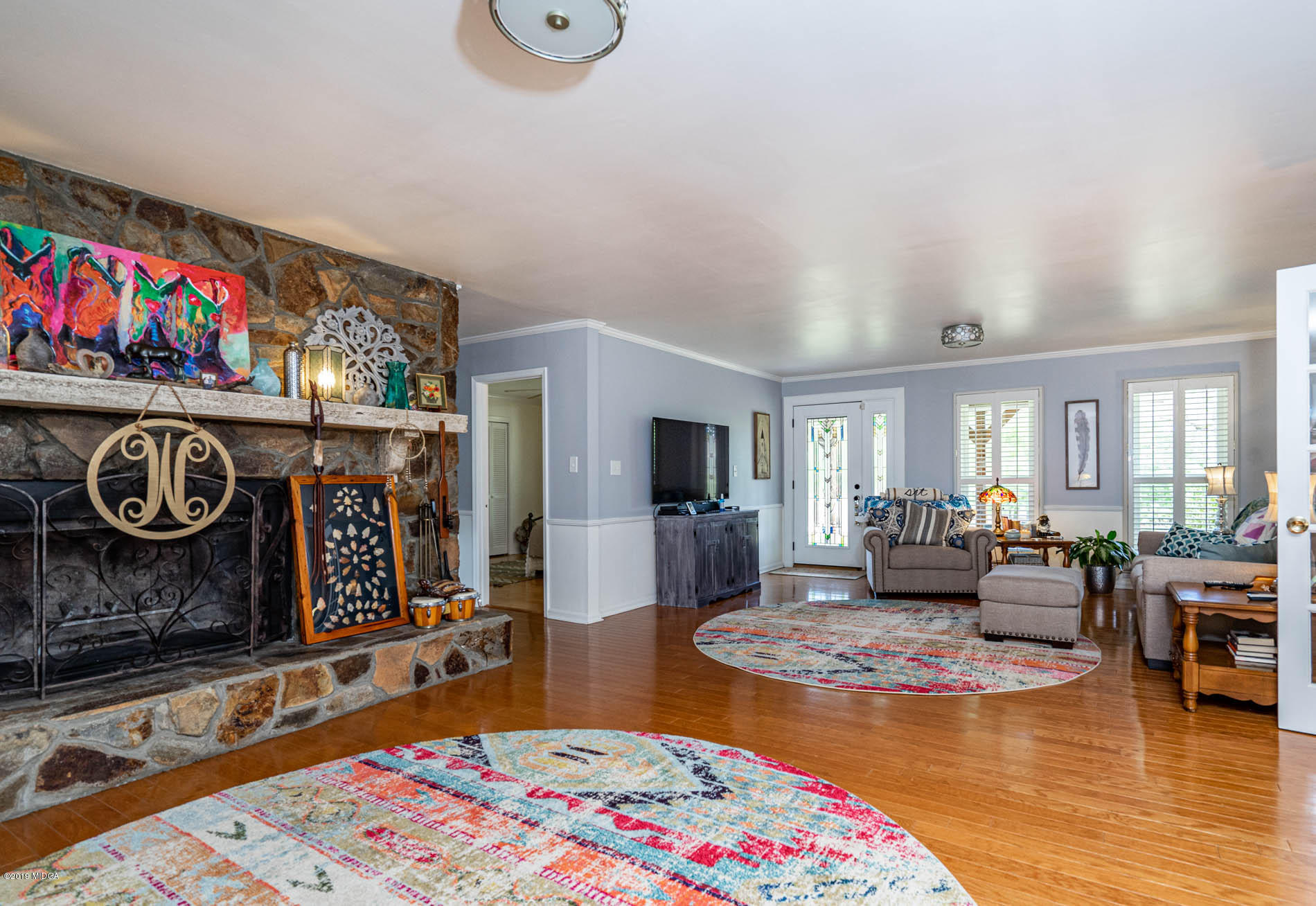 2064 Midway Road Lizella, GA 31052 - Photo 15 of 40 a living room with furniture and a rug