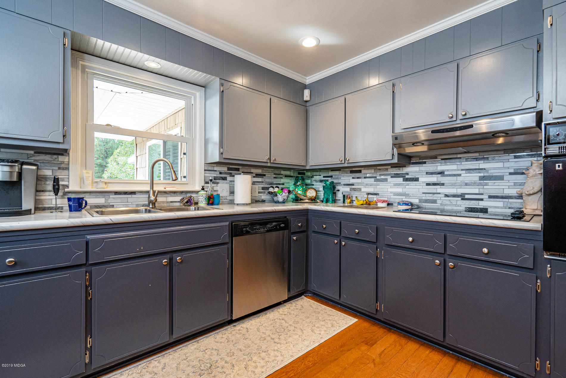 2064 Midway Road Lizella, GA 31052 - Photo 19 of 40 a kitchen with stainless steel appliances granite countertop a sink window and cabinets