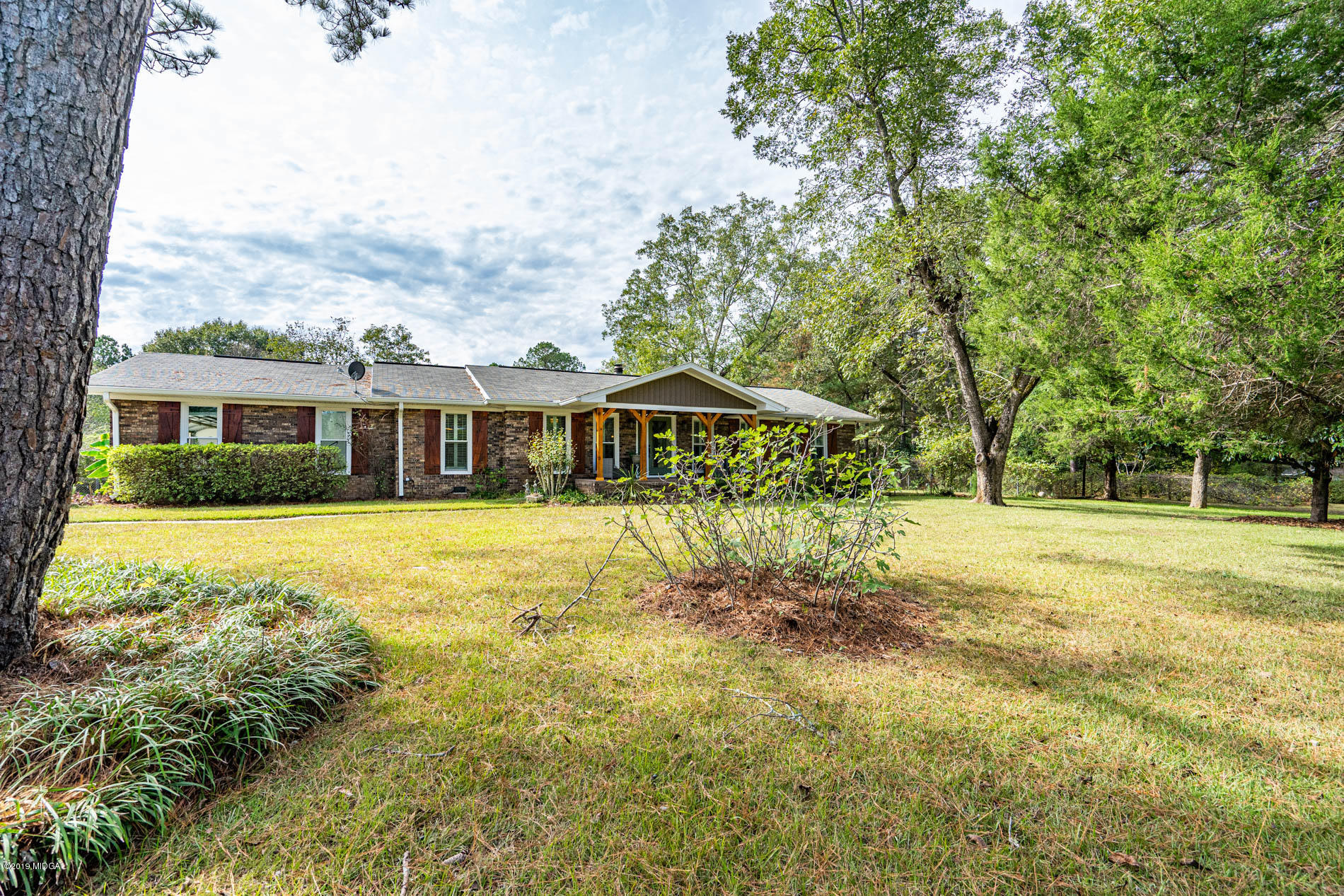 2064 Midway Road Lizella, GA 31052 - Photo 3 of 40 a house with swimming pool in front of it