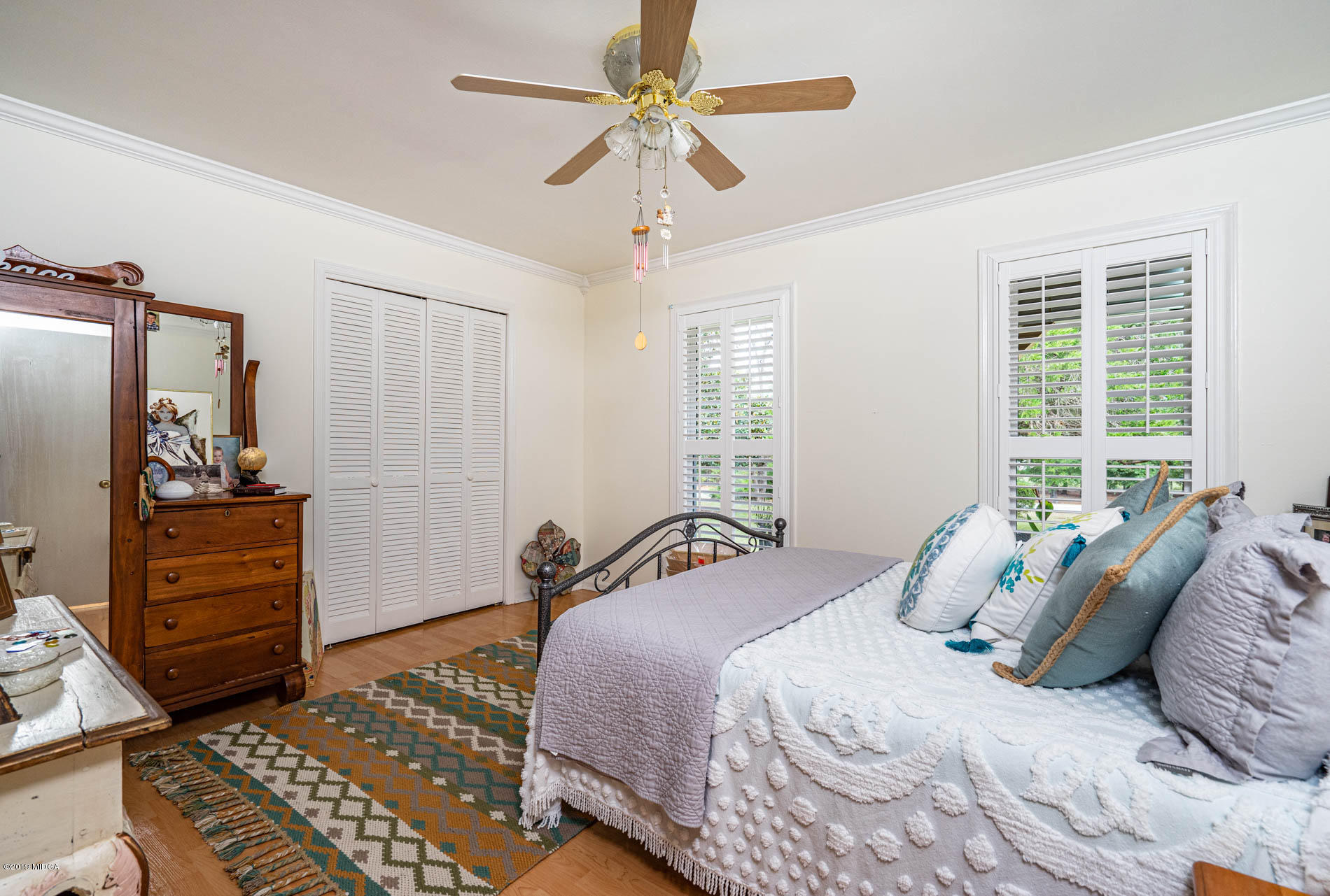 2064 Midway Road Lizella, GA 31052 - Photo 26 of 40 a bedroom with a bed and a chandelier