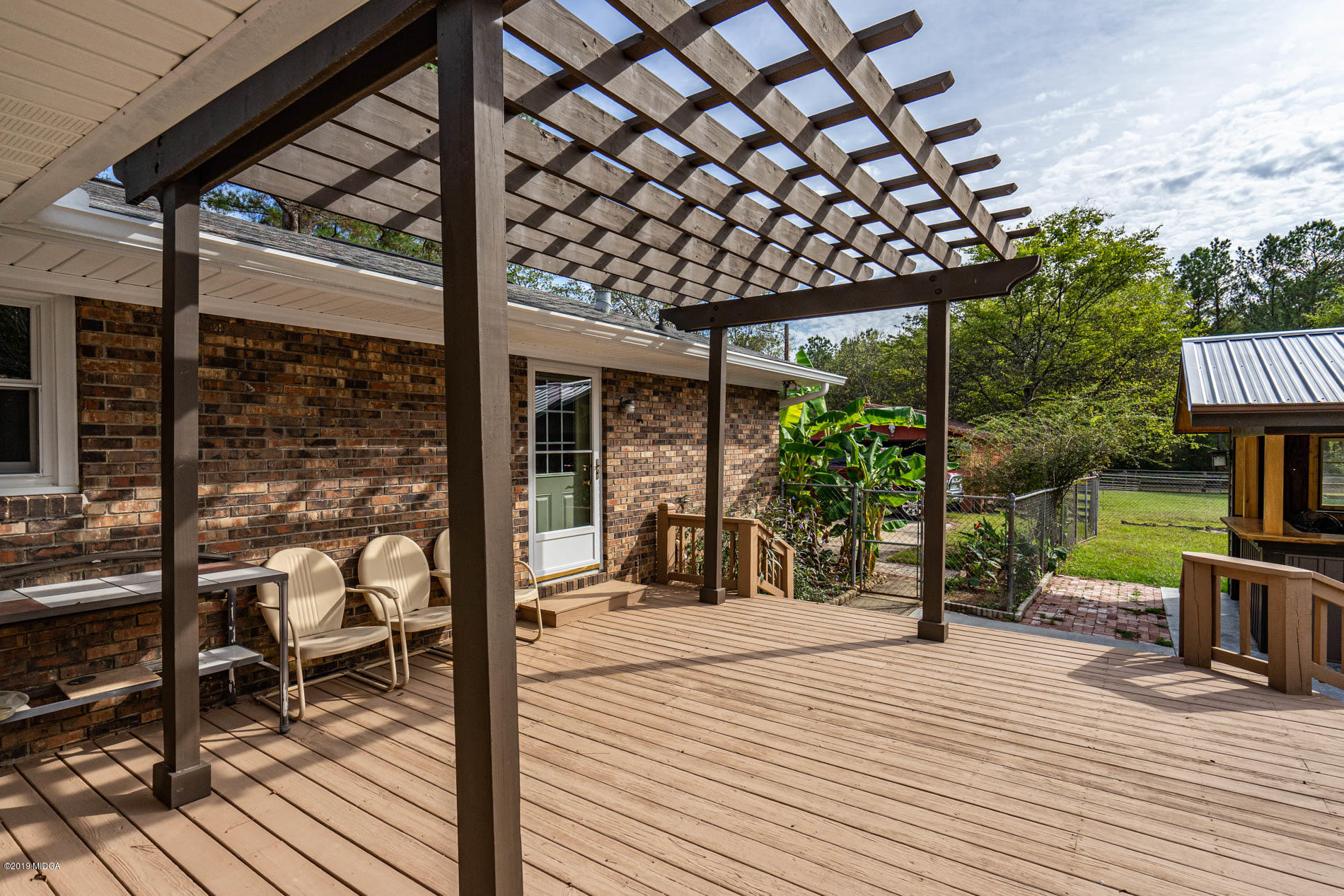 2064 Midway Road Lizella, GA 31052 - Photo 7 of 40 a view of a chairs and tables in the patio