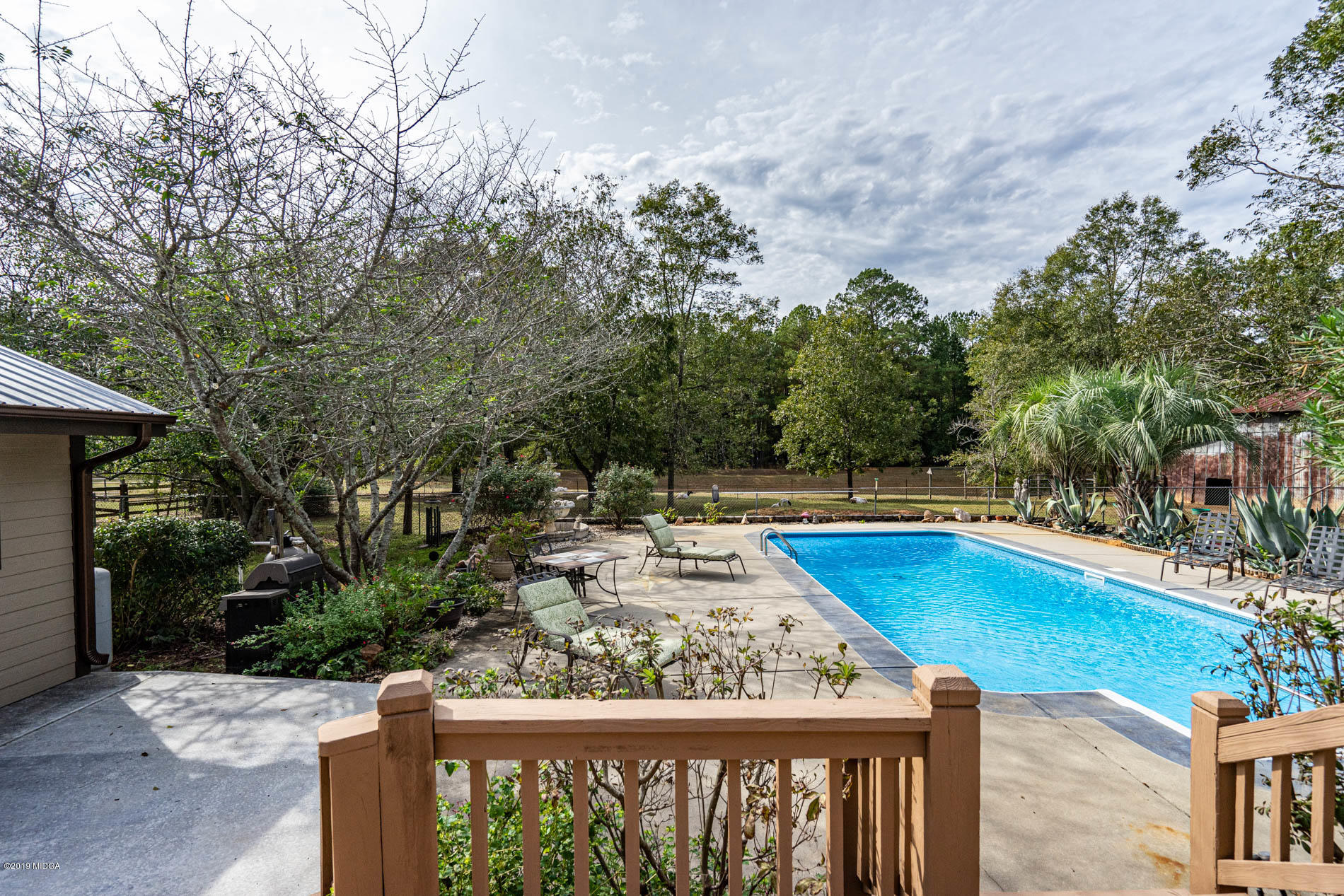 2064 Midway Road Lizella, GA 31052 - Photo 8 of 40 a view of a swimming pool with a patio