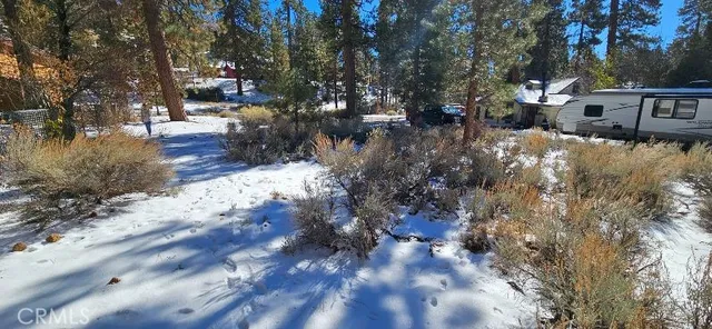 a view of snow on the side of road