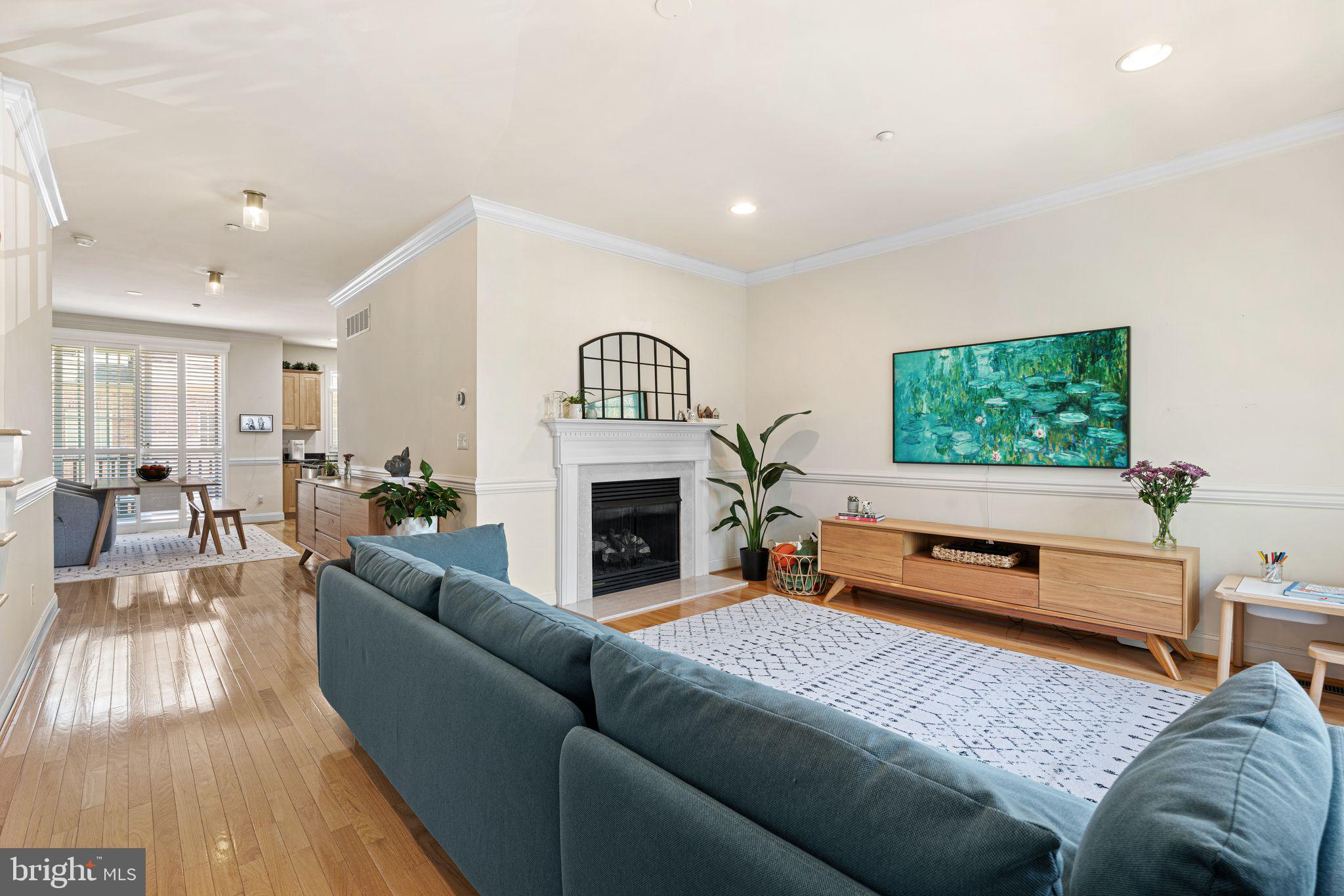 10 Washington Avenue Haddonfield, NJ 08033 - Photo 15 of 35 a living room with furniture a fireplace and a flat screen tv