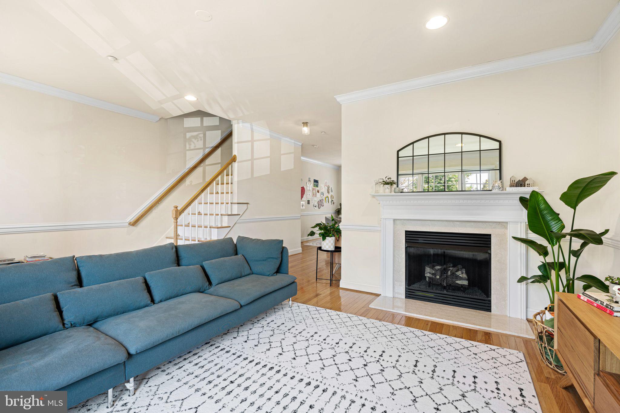 10 Washington Avenue Haddonfield, NJ 08033 - Photo 16 of 35 a living room with furniture a fireplace and a potted plant