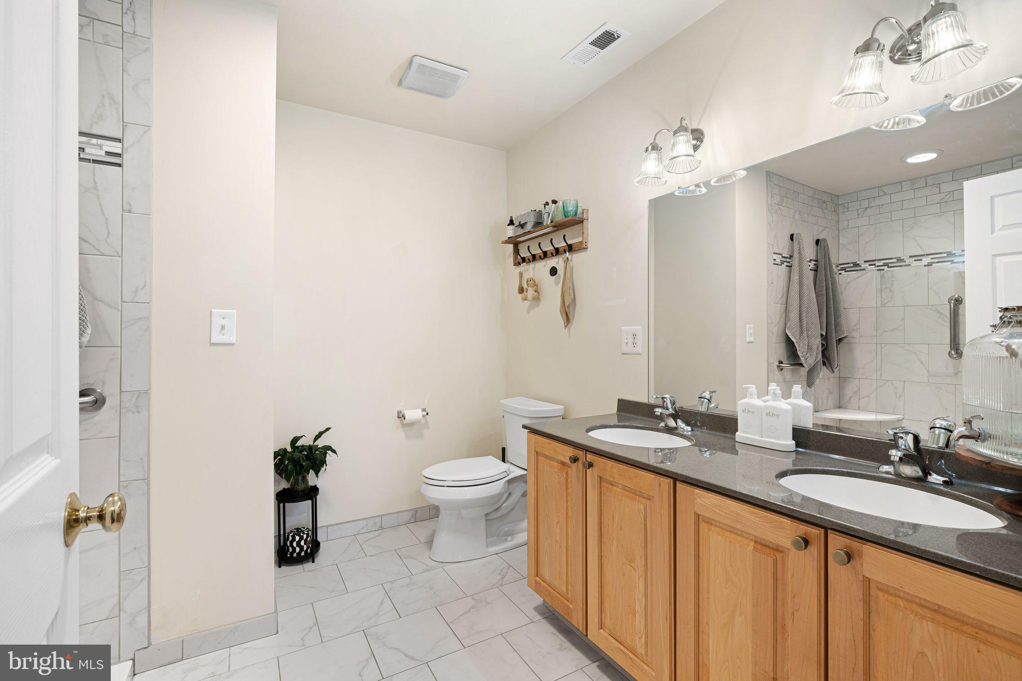 10 Washington Avenue Haddonfield, NJ 08033 - Photo 23 of 35 a bathroom with a granite countertop sink toilet and shower