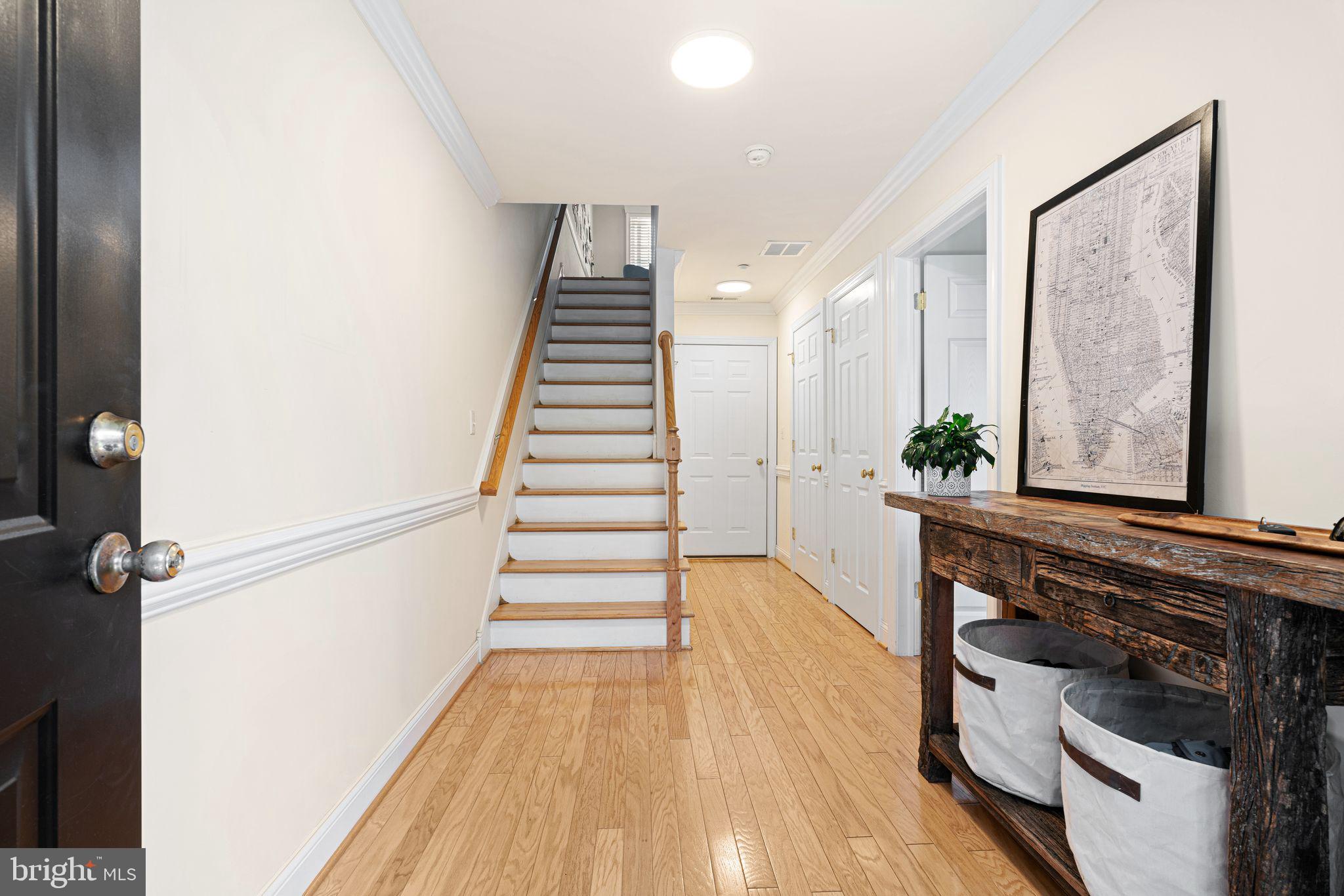 10 Washington Avenue Haddonfield, NJ 08033 - Photo 3 of 35 a view of a hallway with wooden floor and staircase