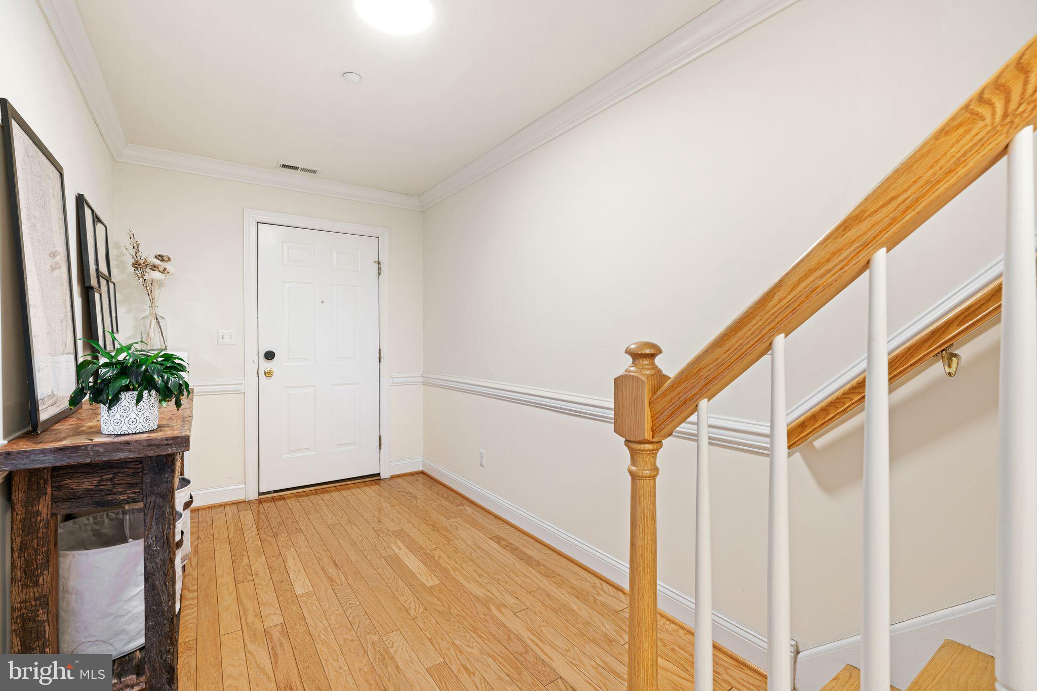 10 Washington Avenue Haddonfield, NJ 08033 - Photo 4 of 35 a view of a hallway with wooden floor and staircase