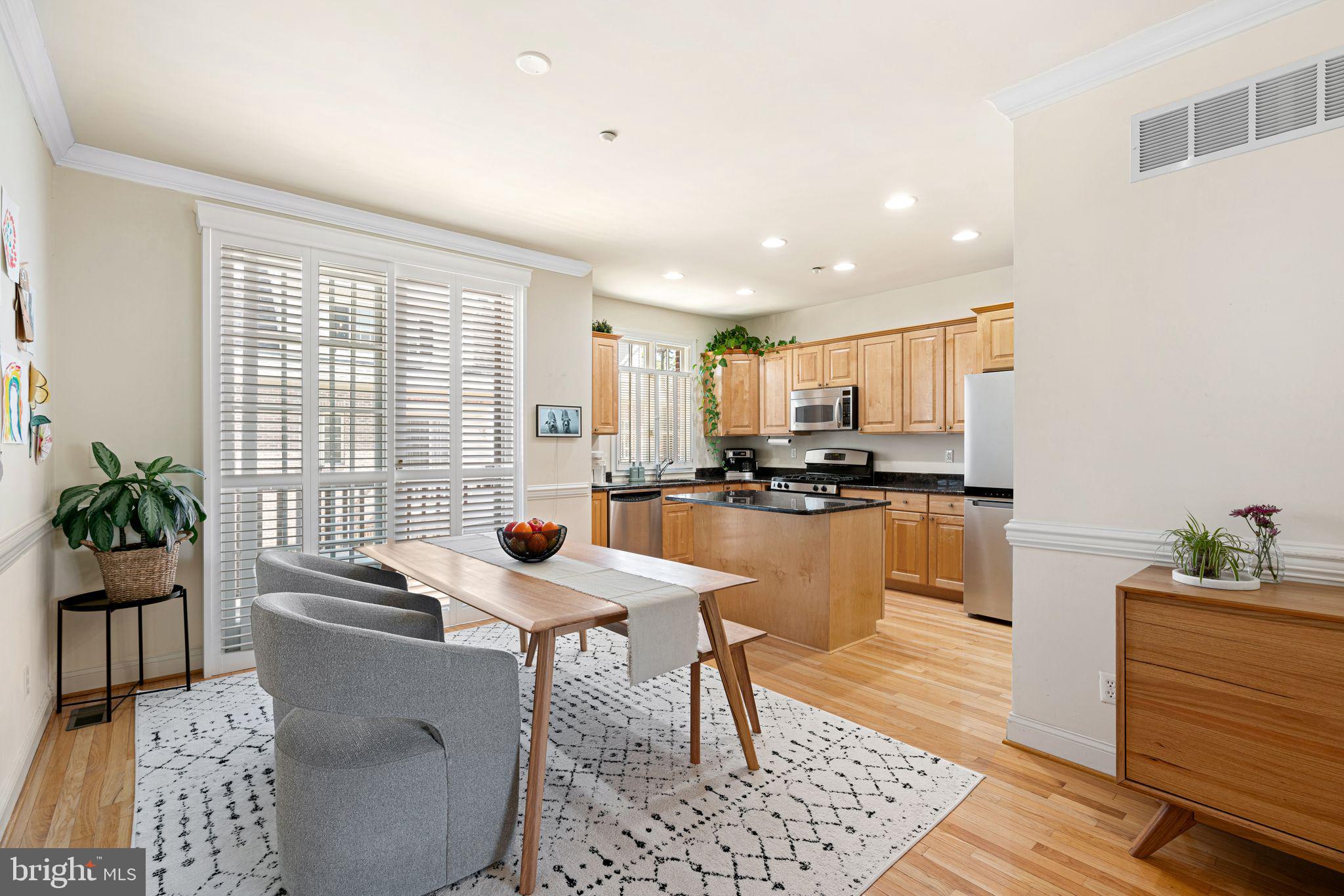 10 Washington Avenue Haddonfield, NJ 08033 - Photo 7 of 35 a kitchen with stainless steel appliances kitchen island granite countertop a sink and cabinets