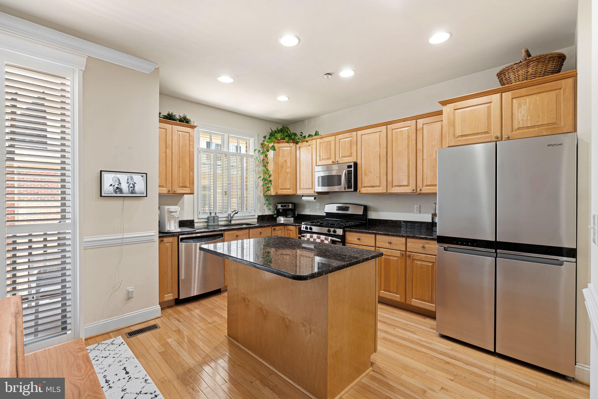 10 Washington Avenue Haddonfield, NJ 08033 - Photo 9 of 35 a kitchen with granite countertop stainless steel appliances a refrigerator sink and microwave
