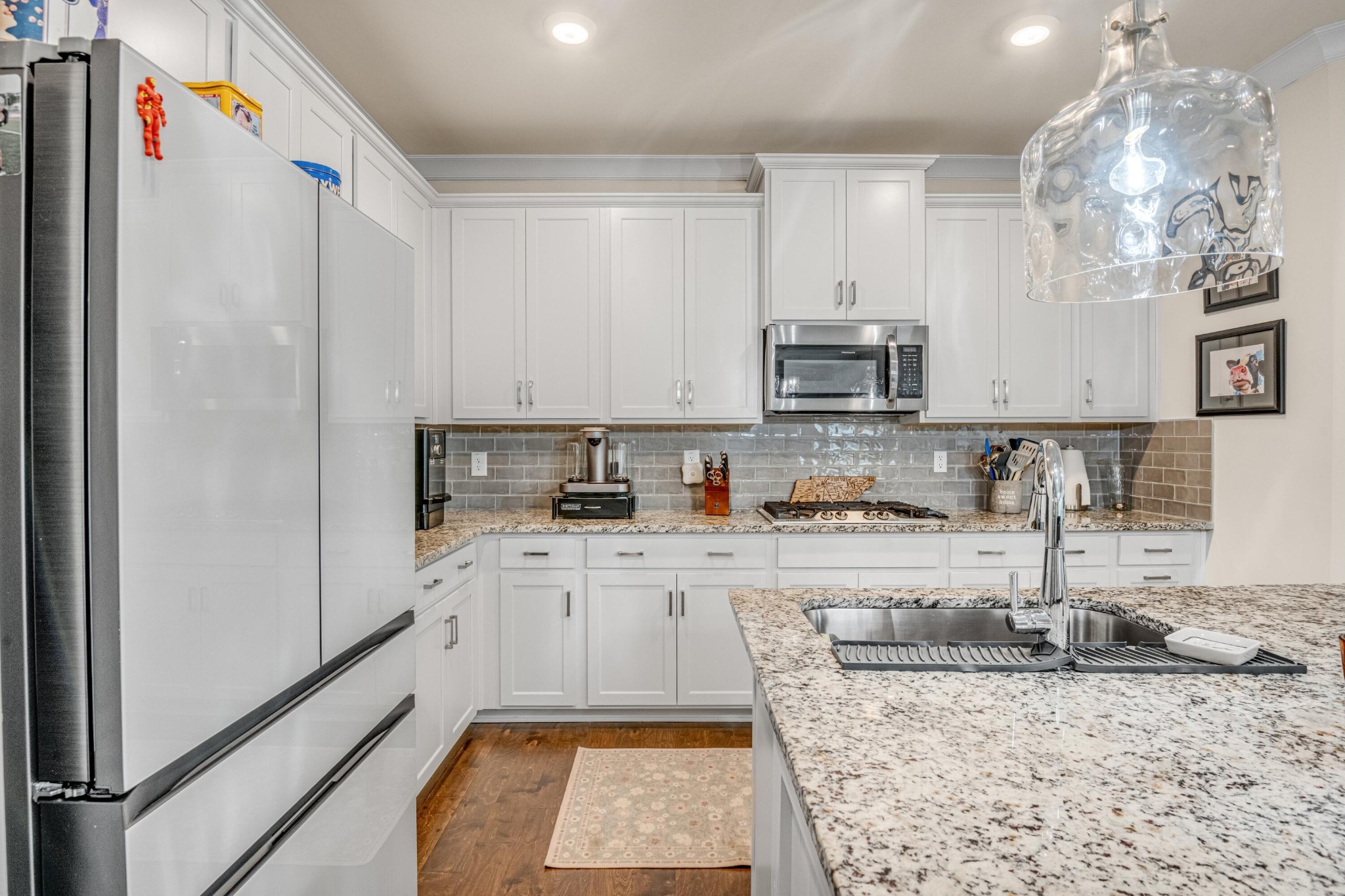 3359 Prairie Range Lane Apison, TN 37302 - Photo 36 of 71 a kitchen with granite countertop a sink stove and refrigerator