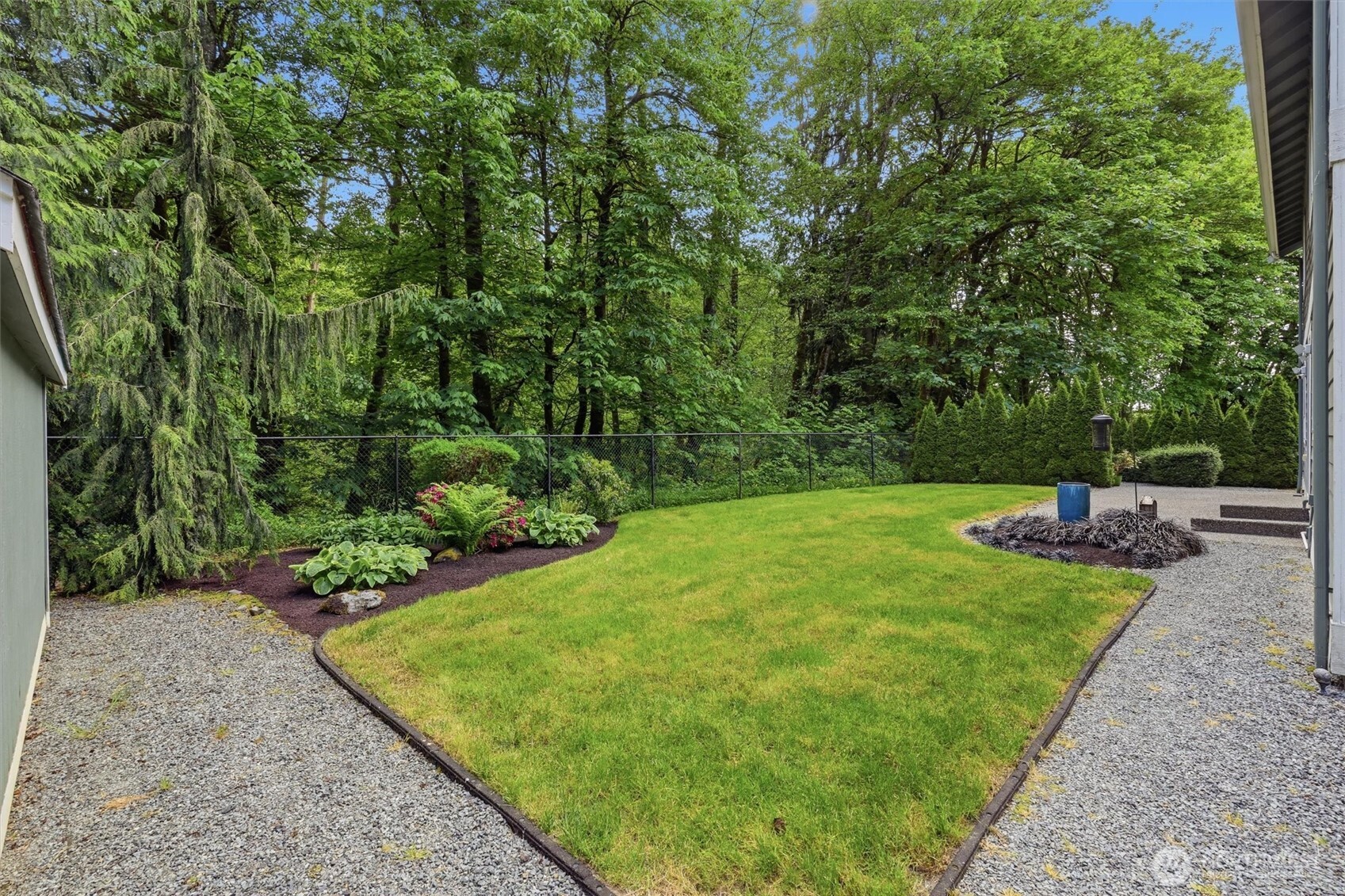 4202 Silvana Terrace Road Stanwood, WA 98292 - Photo 35 of 40 a view of a backyard with a garden