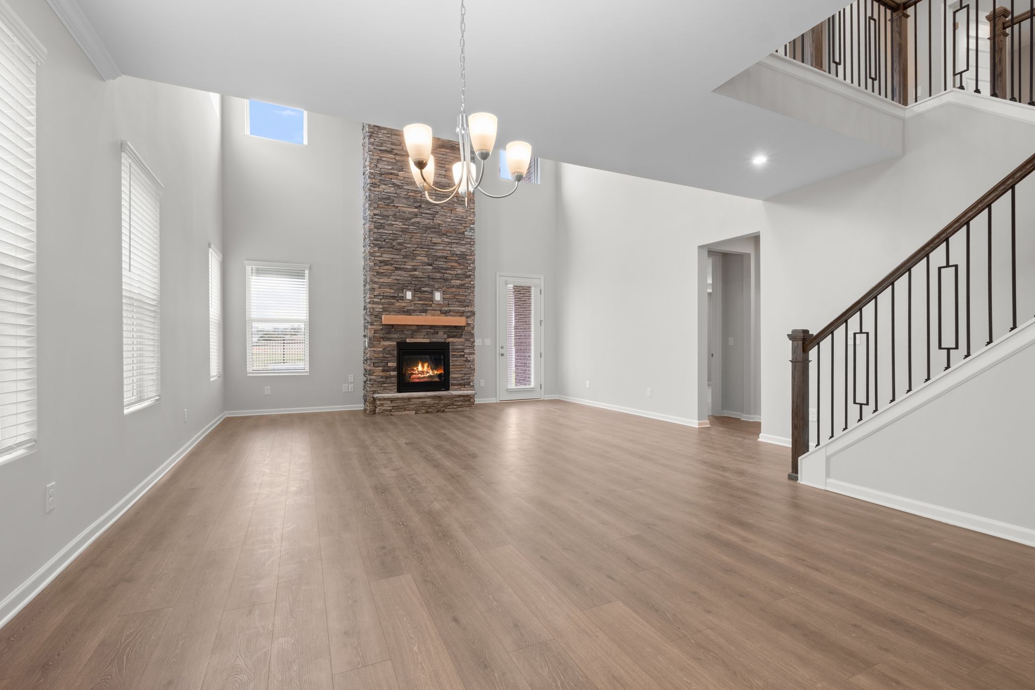 507 Pine Valley Rd Mount Mount Juliet, TN 37122 - Photo 13 of 48 a view of empty room with wooden floor and fireplace