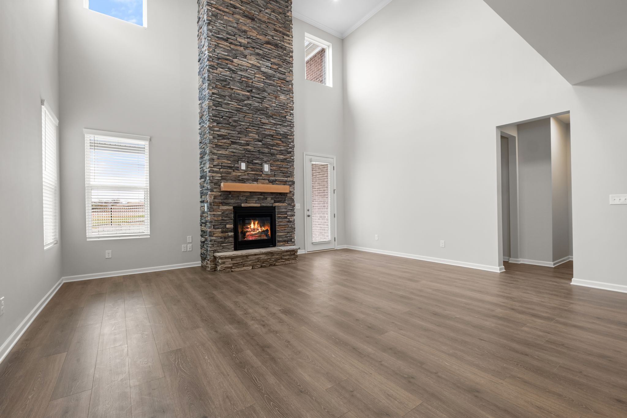 507 Pine Valley Rd Mount Mount Juliet, TN 37122 - Photo 14 of 48 an empty room with wooden floor fireplace and windows