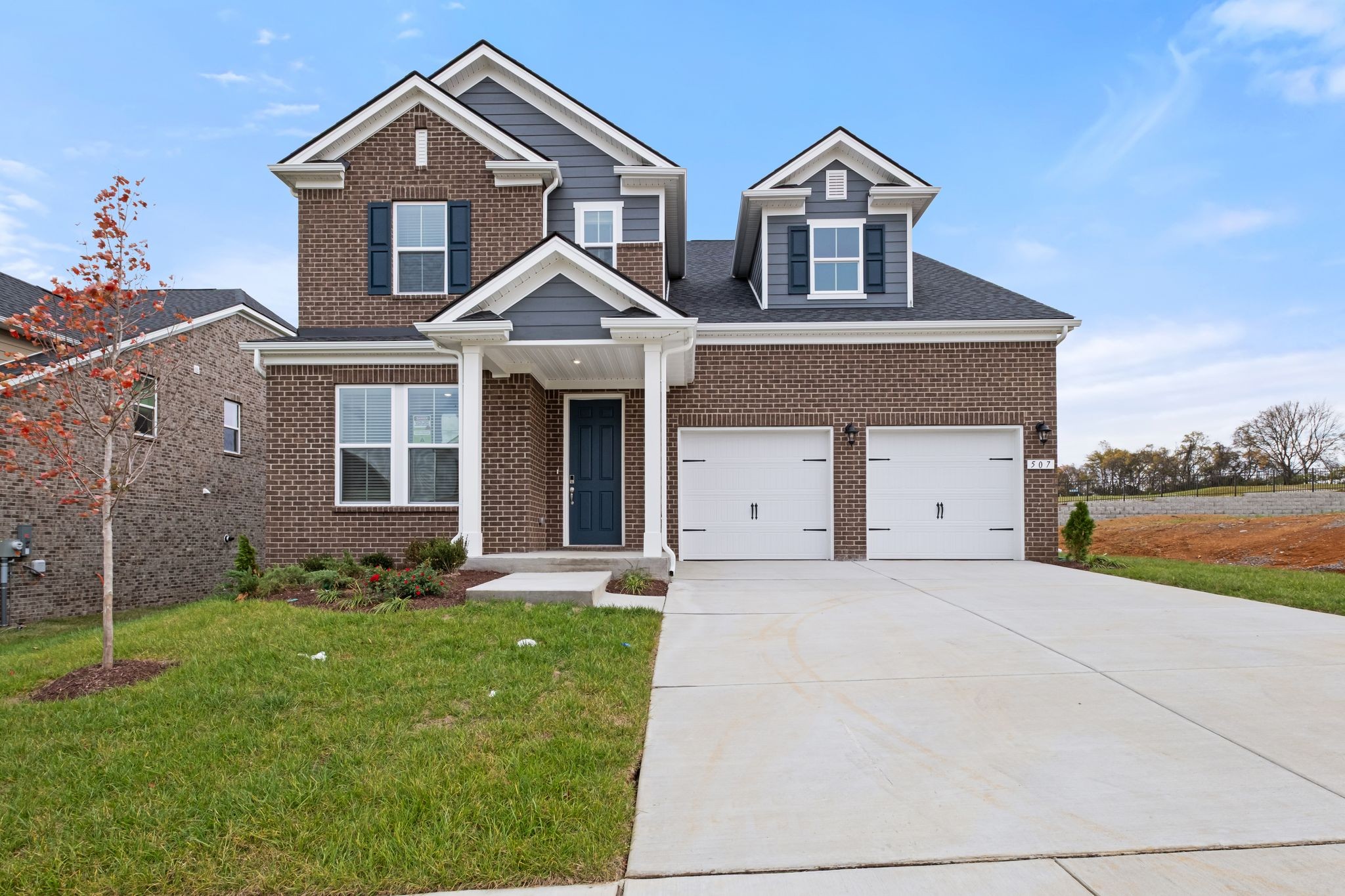 507 Pine Valley Rd Mount Mount Juliet, TN 37122 - Photo 2 of 48 a front view of a house with a yard and garage