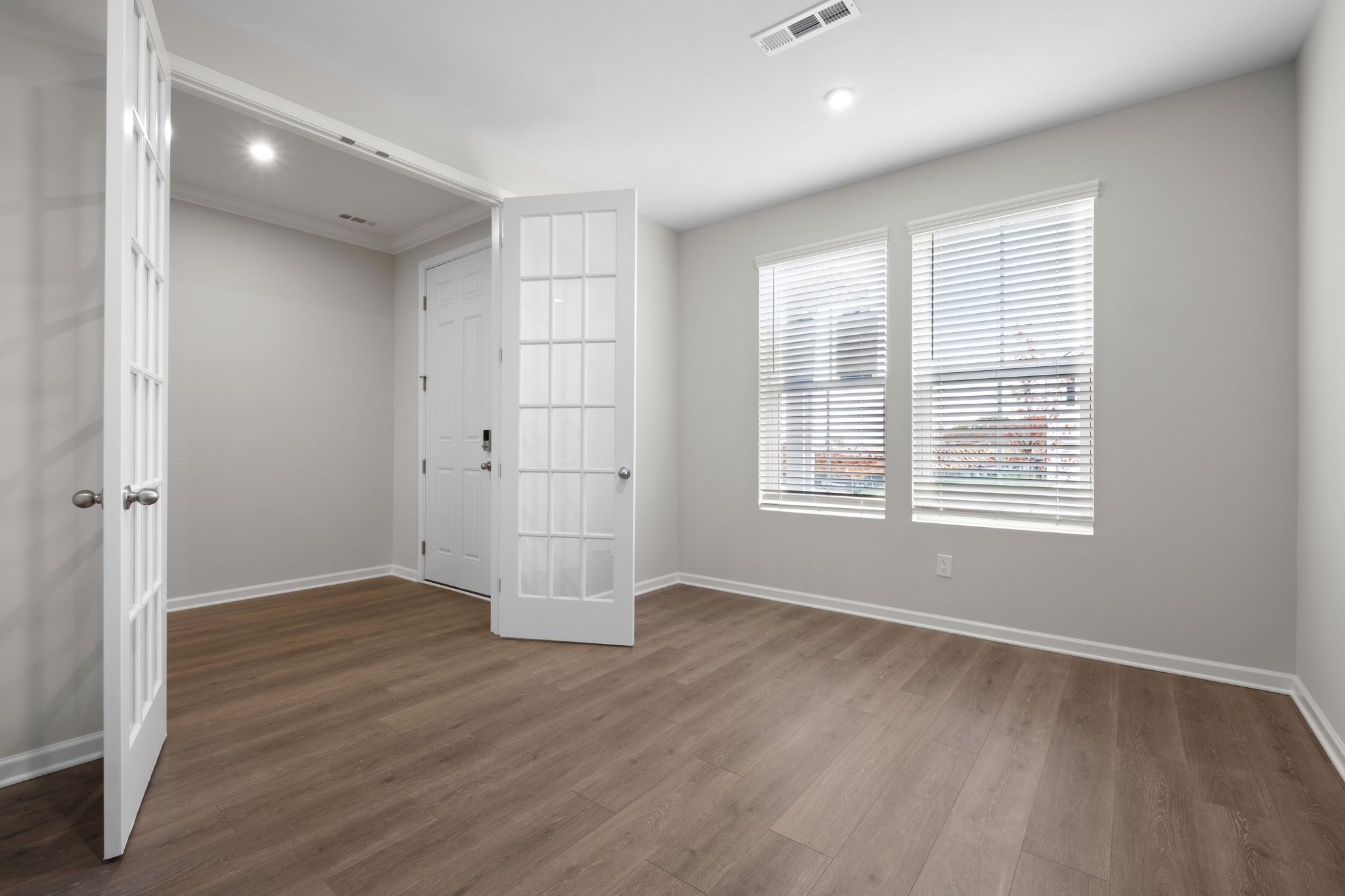 507 Pine Valley Rd Mount Mount Juliet, TN 37122 - Photo 6 of 48 a view of an empty room with wooden floor and a window