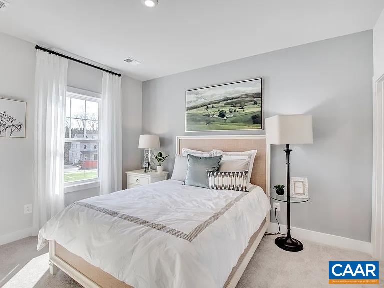1906 Flora Court Charlottesville, VA 22911 - Photo 12 of 16 a bedroom with a bed and a painting on the wall