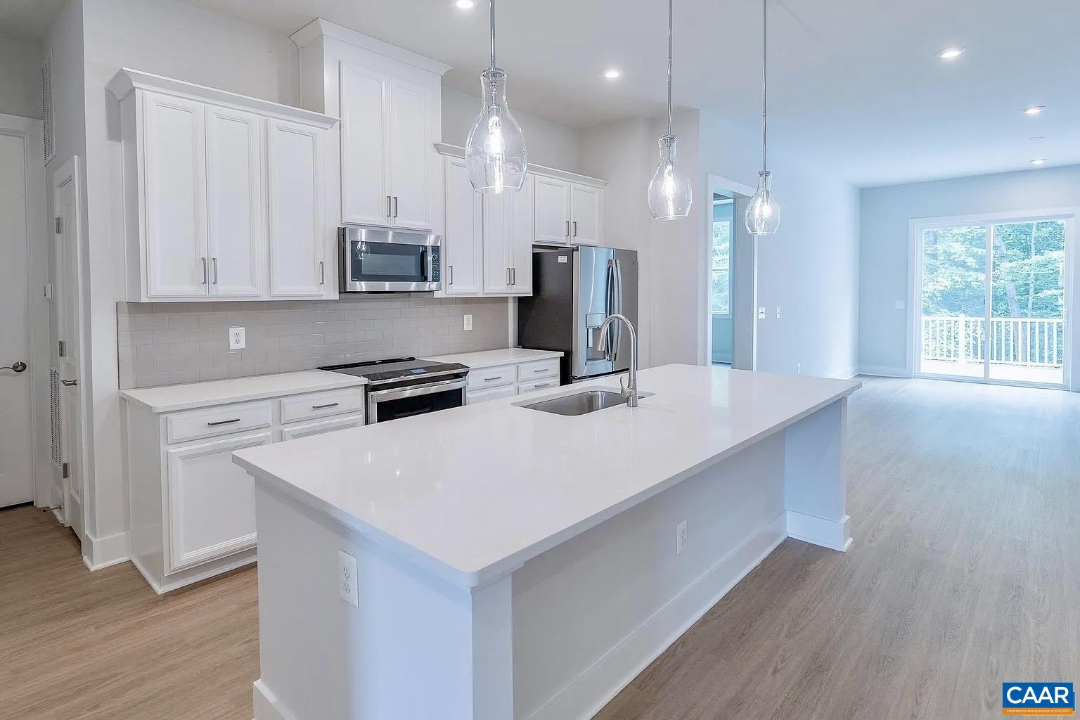 1906 Flora Court Charlottesville, VA 22911 - Photo 2 of 16 a kitchen with kitchen island a sink stainless steel appliances and cabinets