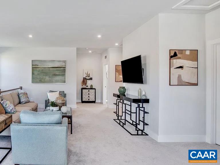 1906 Flora Court Charlottesville, VA 22911 - Photo 10 of 16 a living room with furniture and a flat screen tv