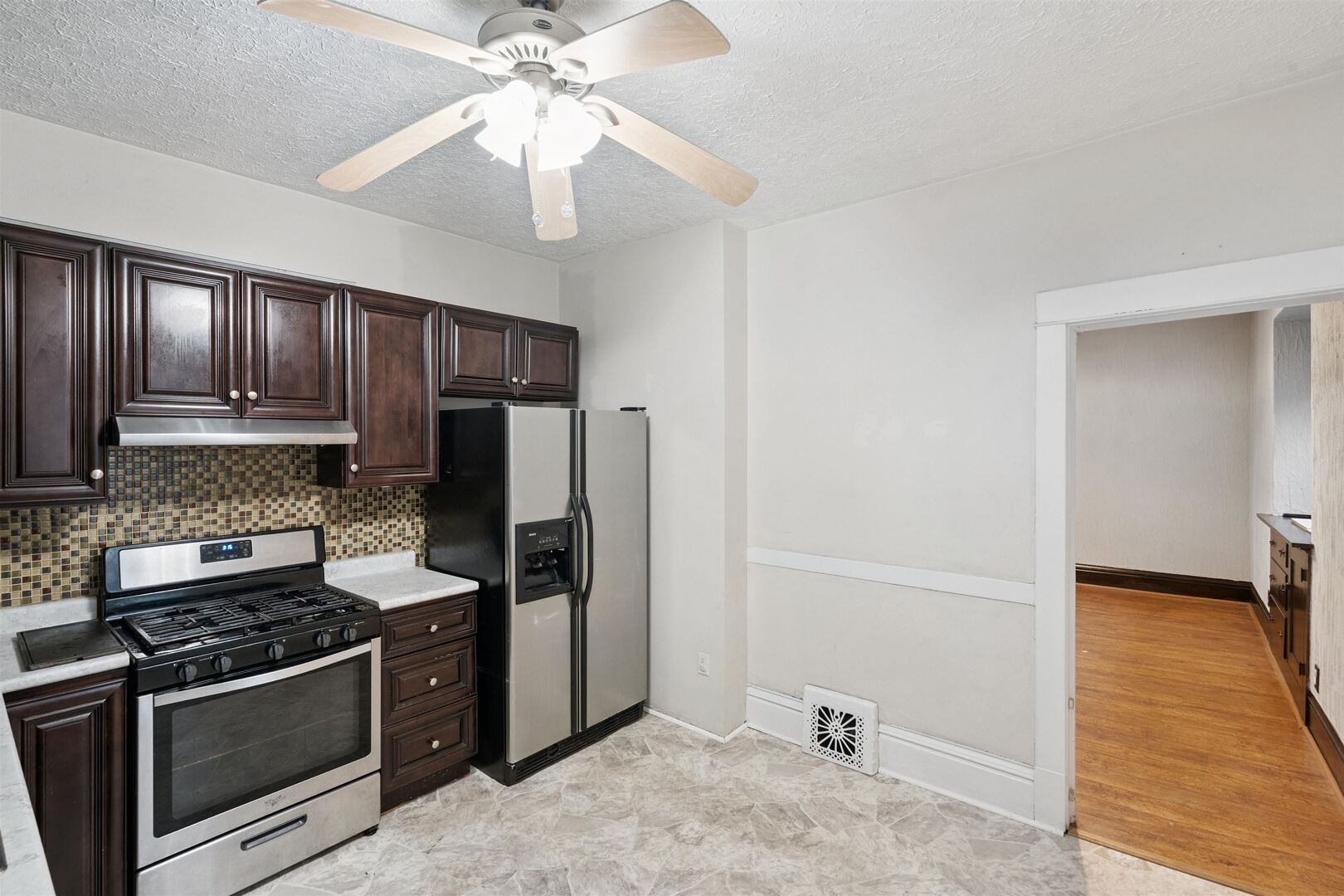 2828 16th Street Moline, IL 61265 - Photo 11 of 39 a kitchen with kitchen island granite countertop stainless steel appliances and wooden cabinets