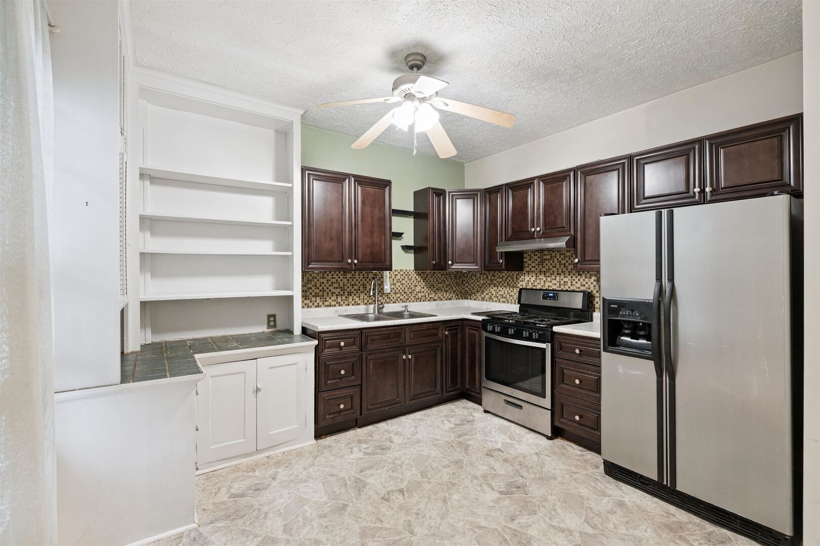 2828 16th Street Moline, IL 61265 - Photo 12 of 39 a kitchen with stainless steel appliances granite countertop a stove refrigerator sink and dishwasher