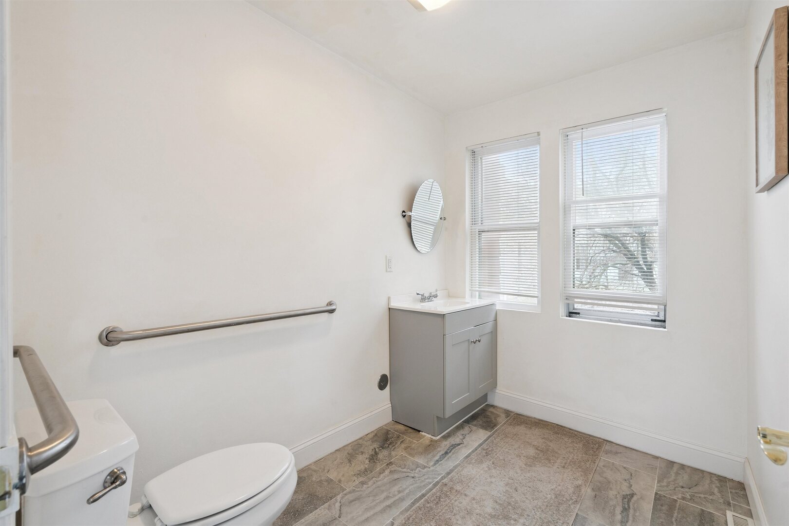2828 16th Street Moline, IL 61265 - Photo 15 of 39 a bathroom with a granite countertop toilet sink and mirror