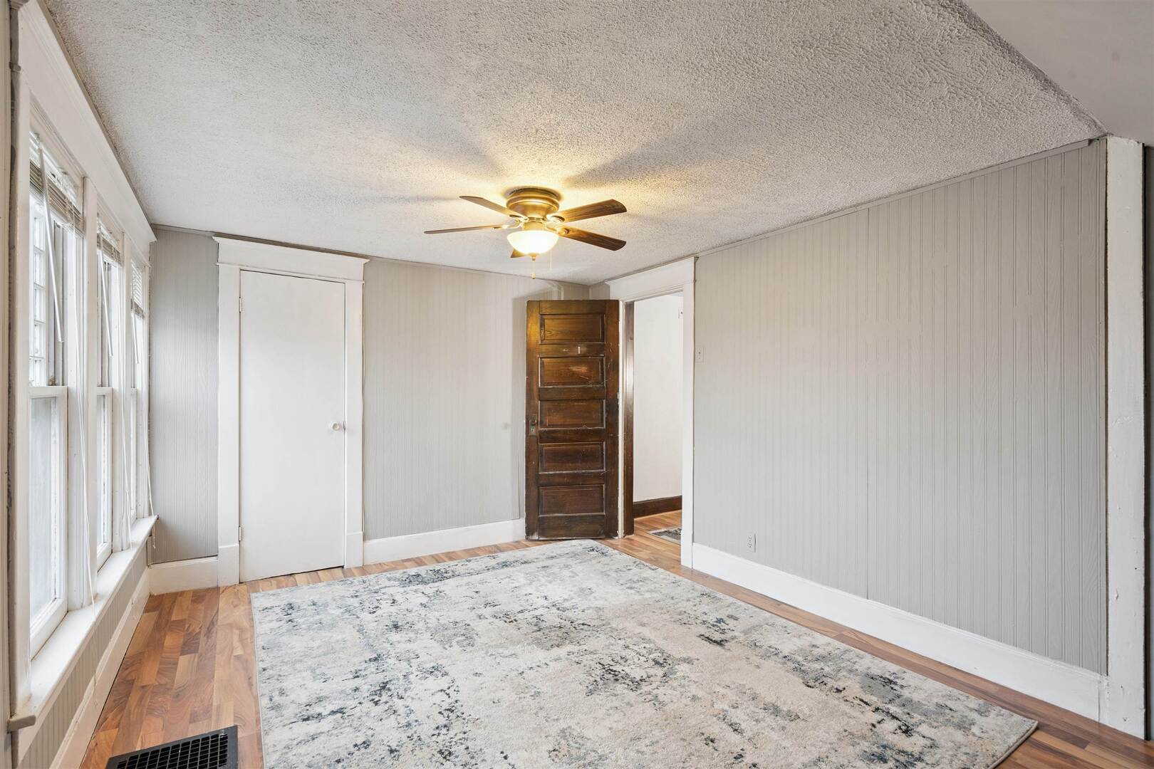 2828 16th Street Moline, IL 61265 - Photo 16 of 39 a view of a livingroom with a chandelier fan and closet