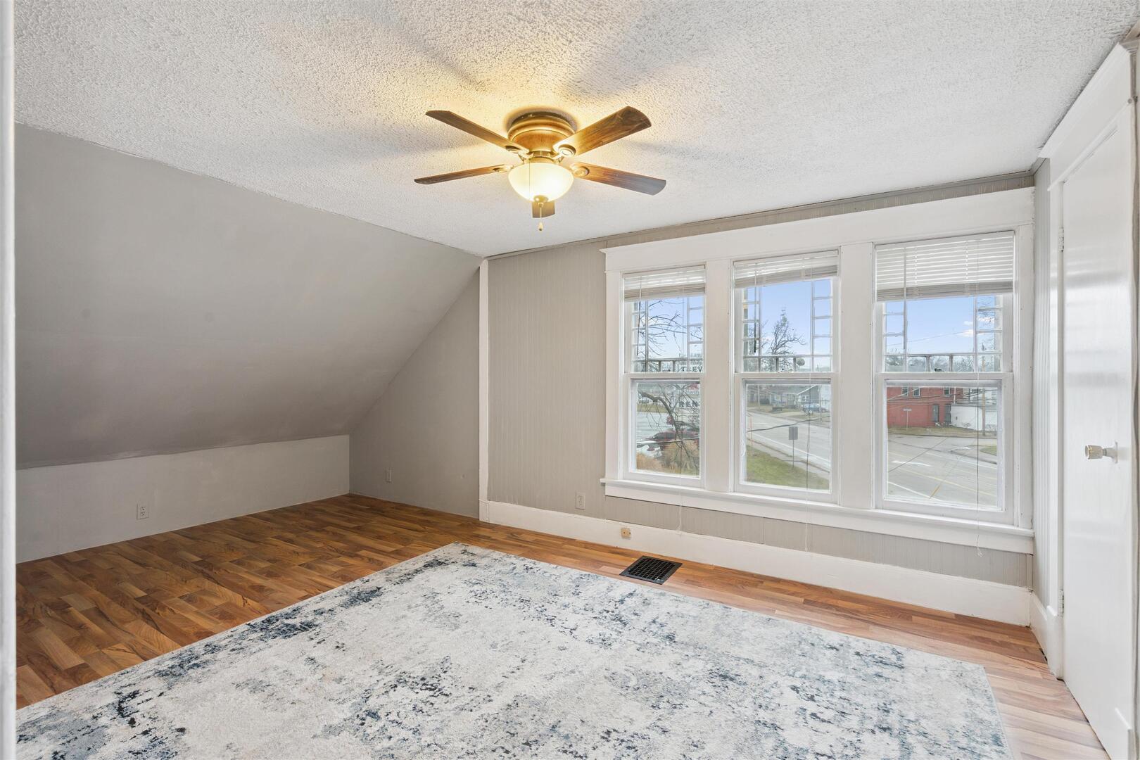 2828 16th Street Moline, IL 61265 - Photo 17 of 39 a view of a livingroom with a window and a ceiling fan