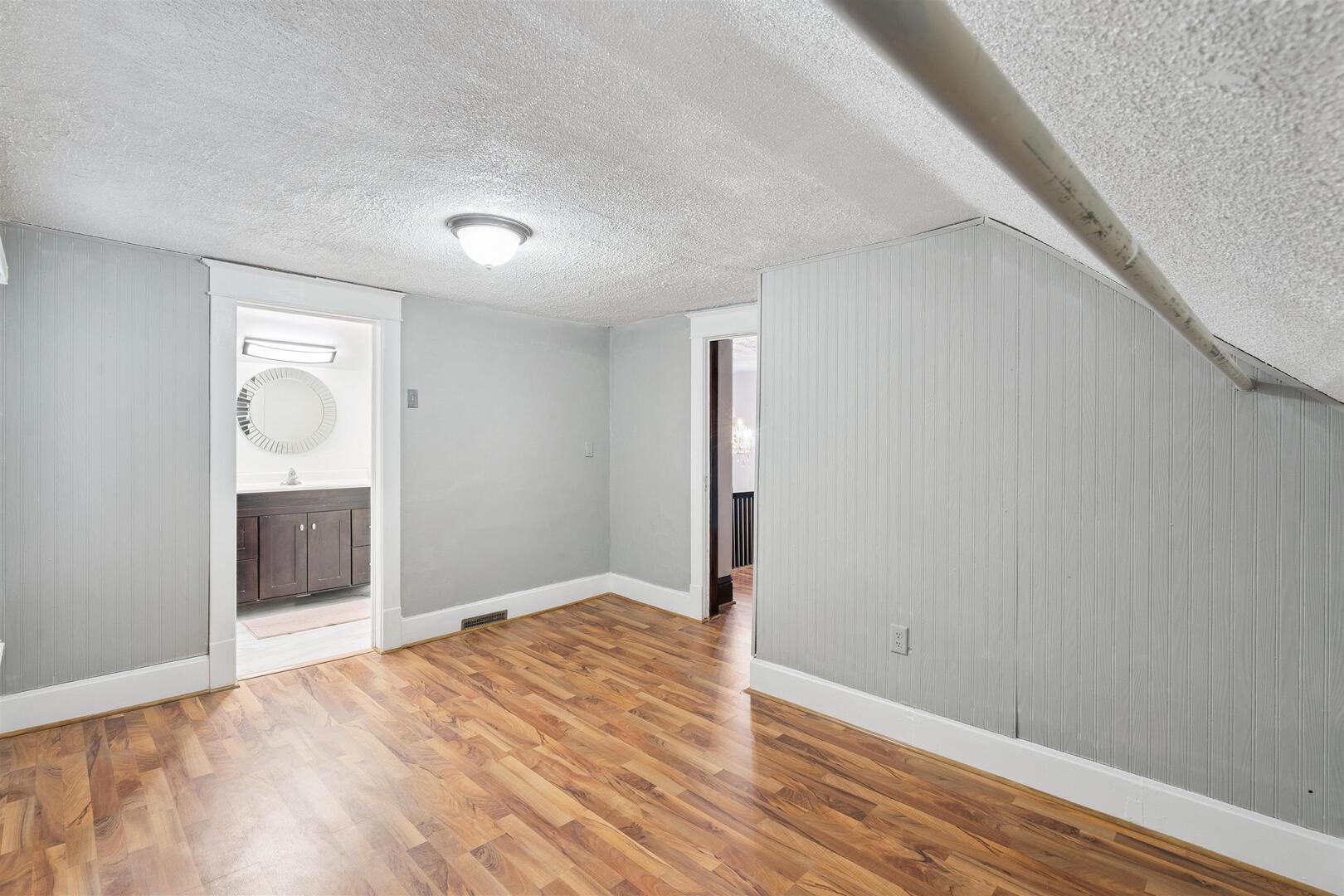 2828 16th Street Moline, IL 61265 - Photo 20 of 39 a view of an empty room with wooden floor