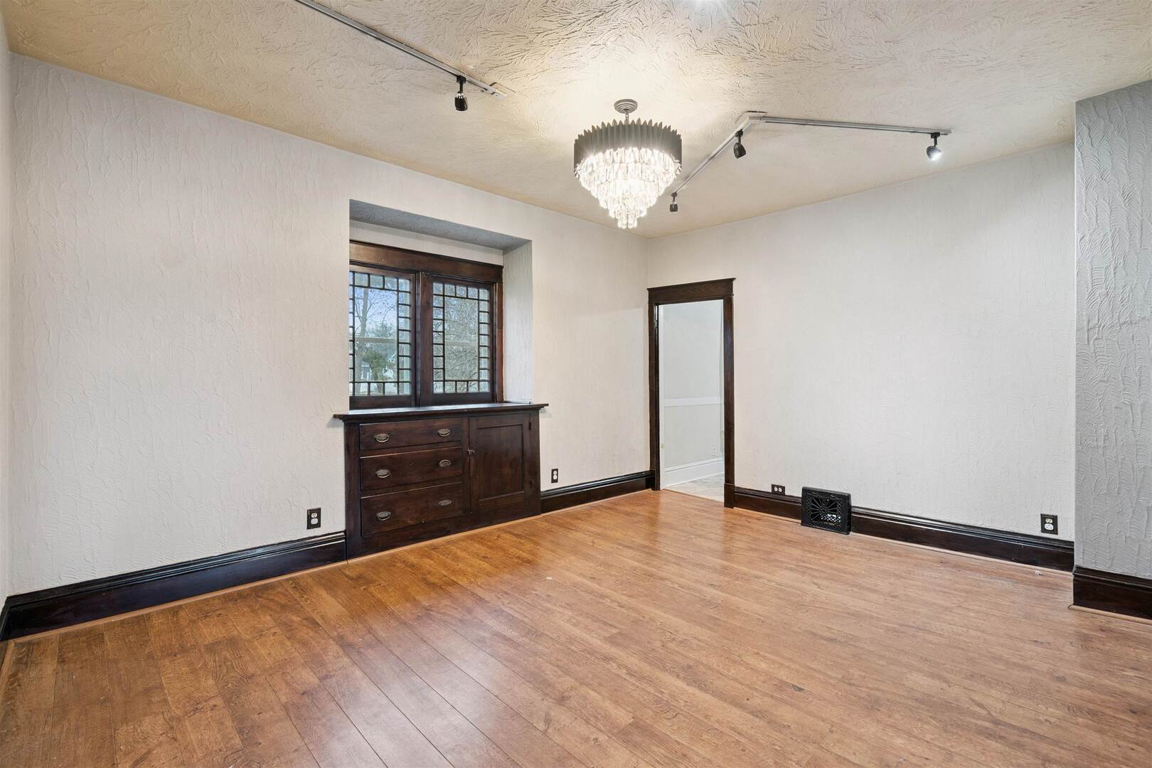 2828 16th Street Moline, IL 61265 - Photo 9 of 39 wooden floor in an empty room with a window