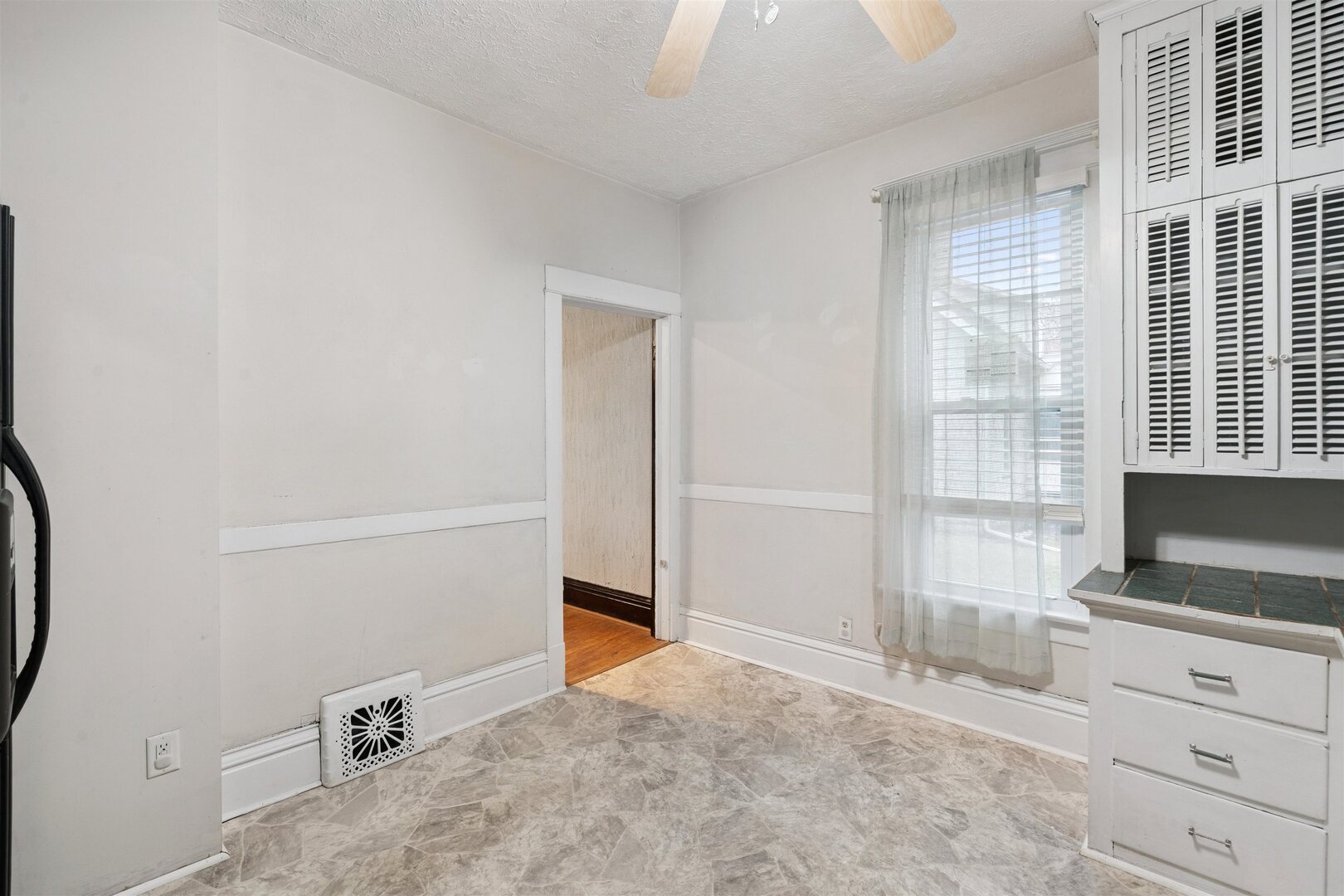 2828 16th Street Moline, IL 61265 - Photo 10 of 39 a view of a kitchen with an empty space and a window