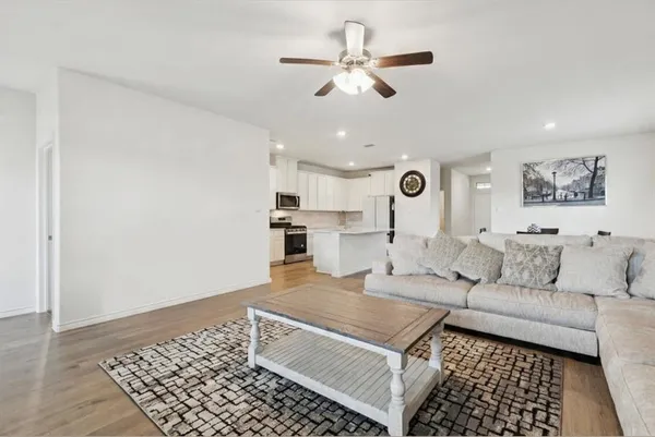 a living room with furniture and a rug