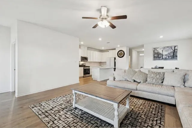 a living room with furniture and a rug