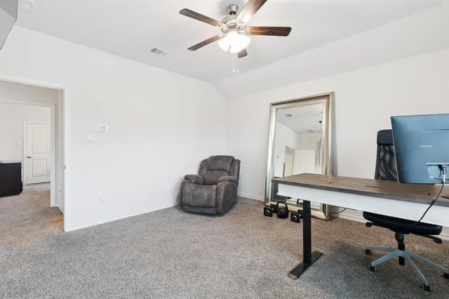 a room with gym equipment and a window