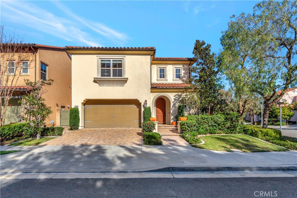 83 Navigator Irvine, CA 92620 - Photo 1 of 19 a front view of a house with garden