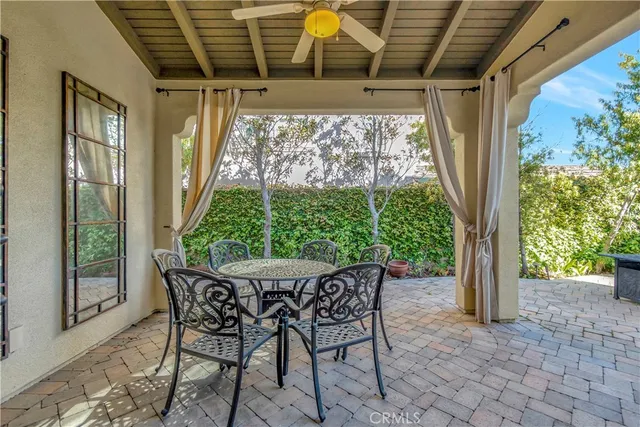 a view of a patio with chair and tables