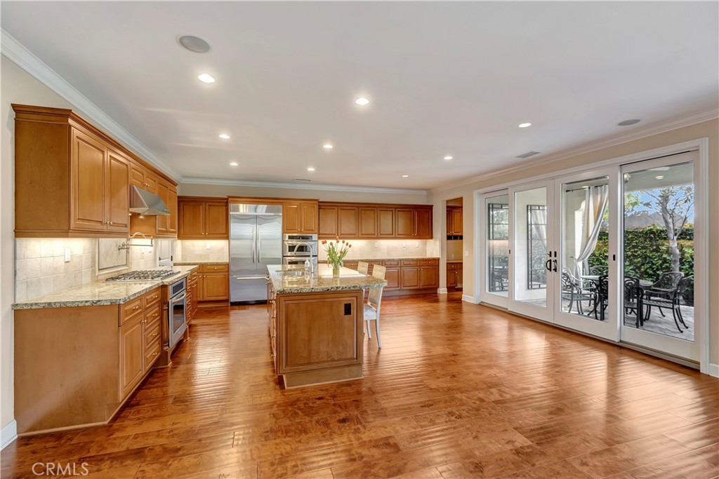 83 Navigator Irvine, CA 92620 - Photo 2 of 19 a view of a kitchen with kitchen island wooden floors and stainless steel appliances