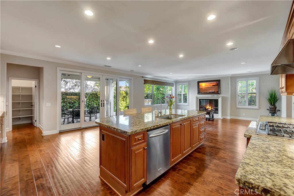 83 Navigator Irvine, CA 92620 - Photo 3 of 19 a kitchen with stainless steel appliances granite countertop a stove and wooden floor