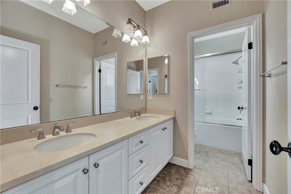 83 Navigator Irvine, CA 92620 - Photo 9 of 19 a bathroom with a sink double vanity granite tub and shower