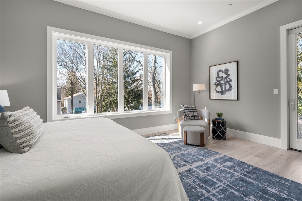 28 Wilson Circle, Unit 28 Newton, MA 02461 - Photo 12 of 14 a bedroom with a large bed and a couch