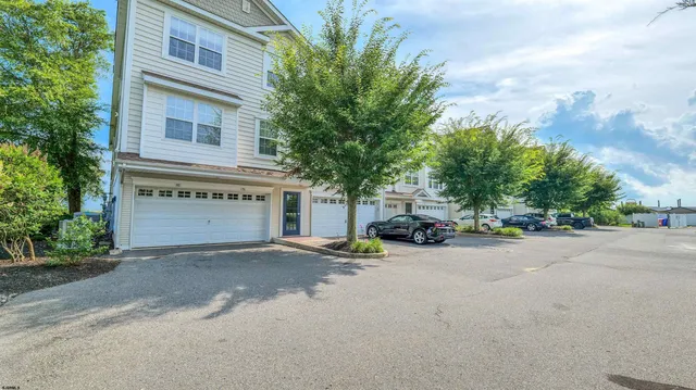 a view of a street with a parked cars
