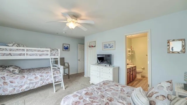 a bedroom with a bed and a view of kitchen