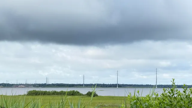 a view of a swimming pool and an outdoor seating