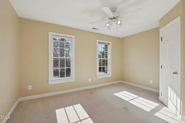 a bathroom with a sink a toilet and shower curtain