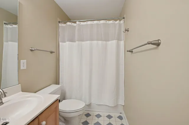 a bathroom with a sink double vanity and a mirror