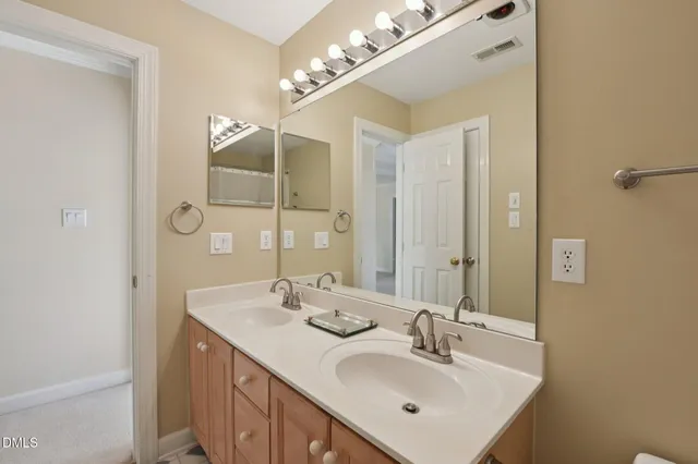 an empty room with windows and ceiling fan
