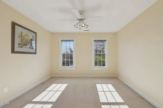 a backyard view with a table and chairs