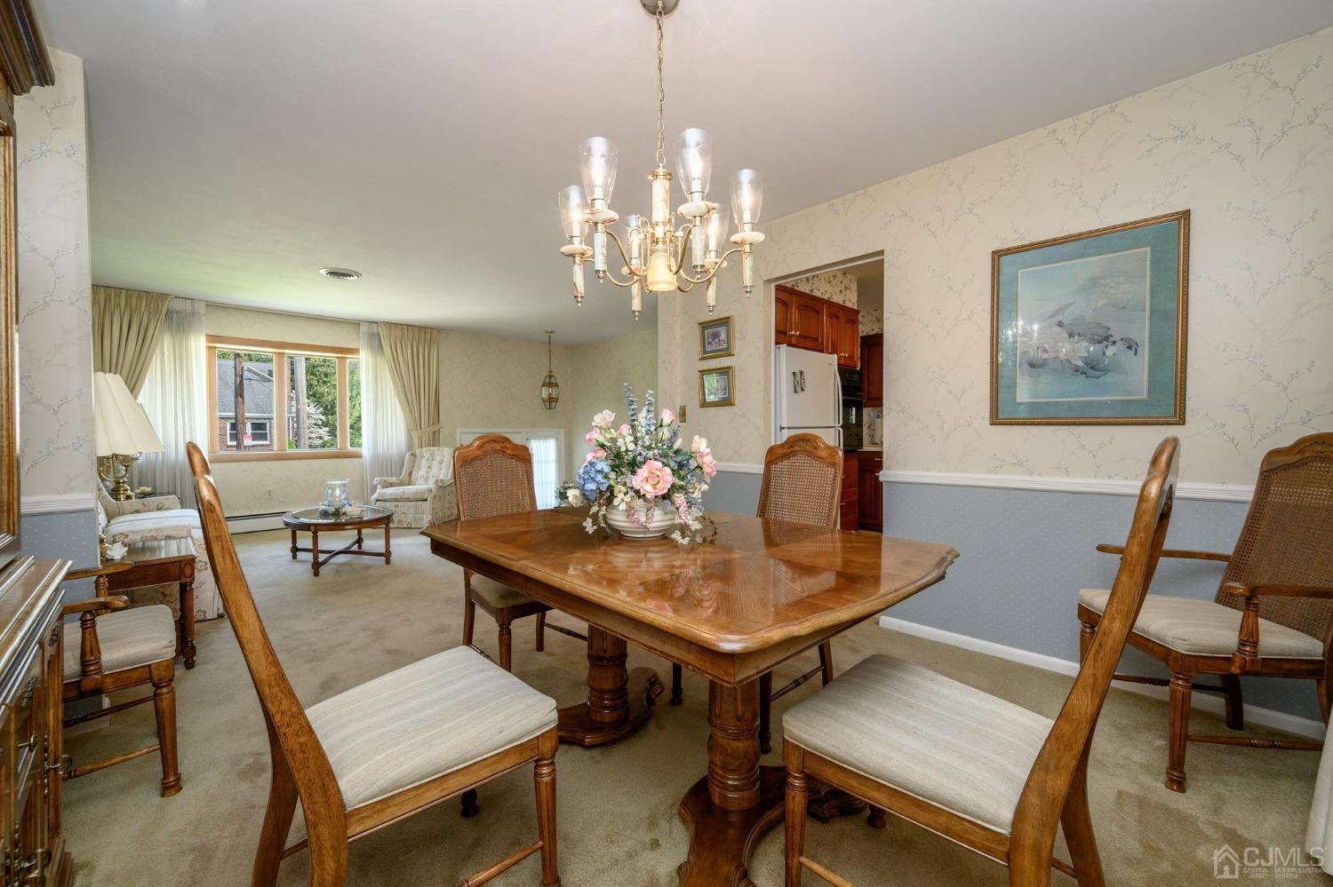 649 Klockner Road Hamilton, NJ 08619 - Photo 8 of 39 a view of a dining room with furniture a chandelier and wooden floor