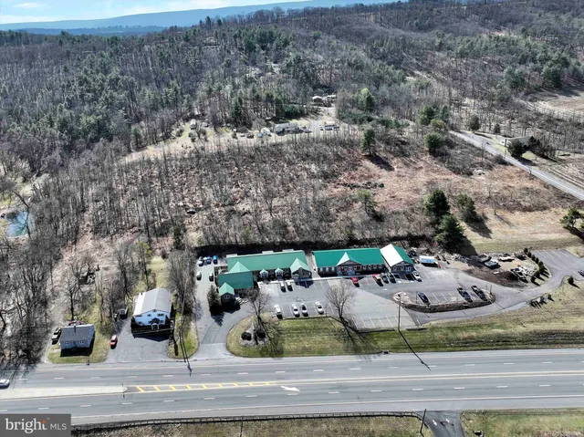 an aerial view of a yard with table and chairs