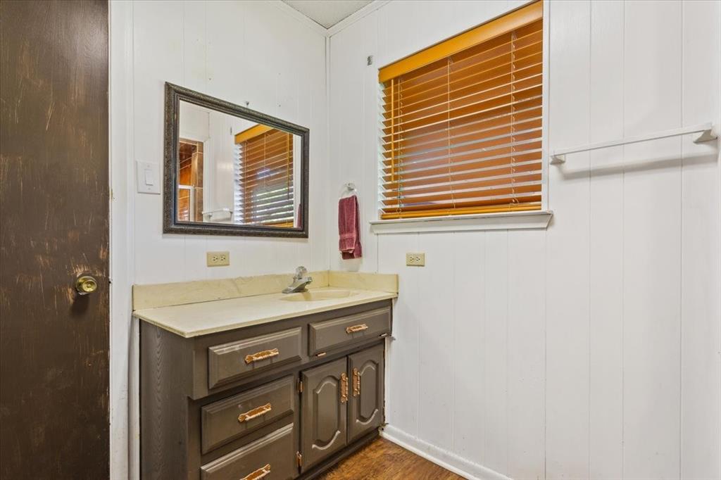 221 County Road 157 Riesel, TX 76682 - Photo 23 of 30 a bathroom with a sink a vanity and a window